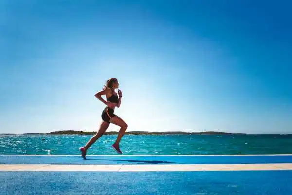 Woman running showing strong leg muscle Warminster